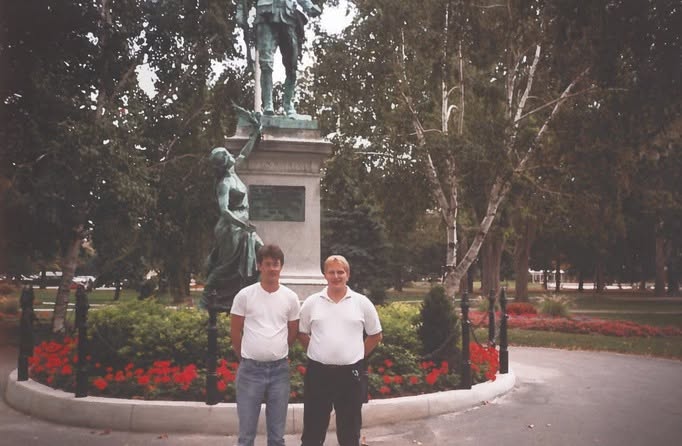 Barry Jacklin and his partner Kevin standing together at a monument